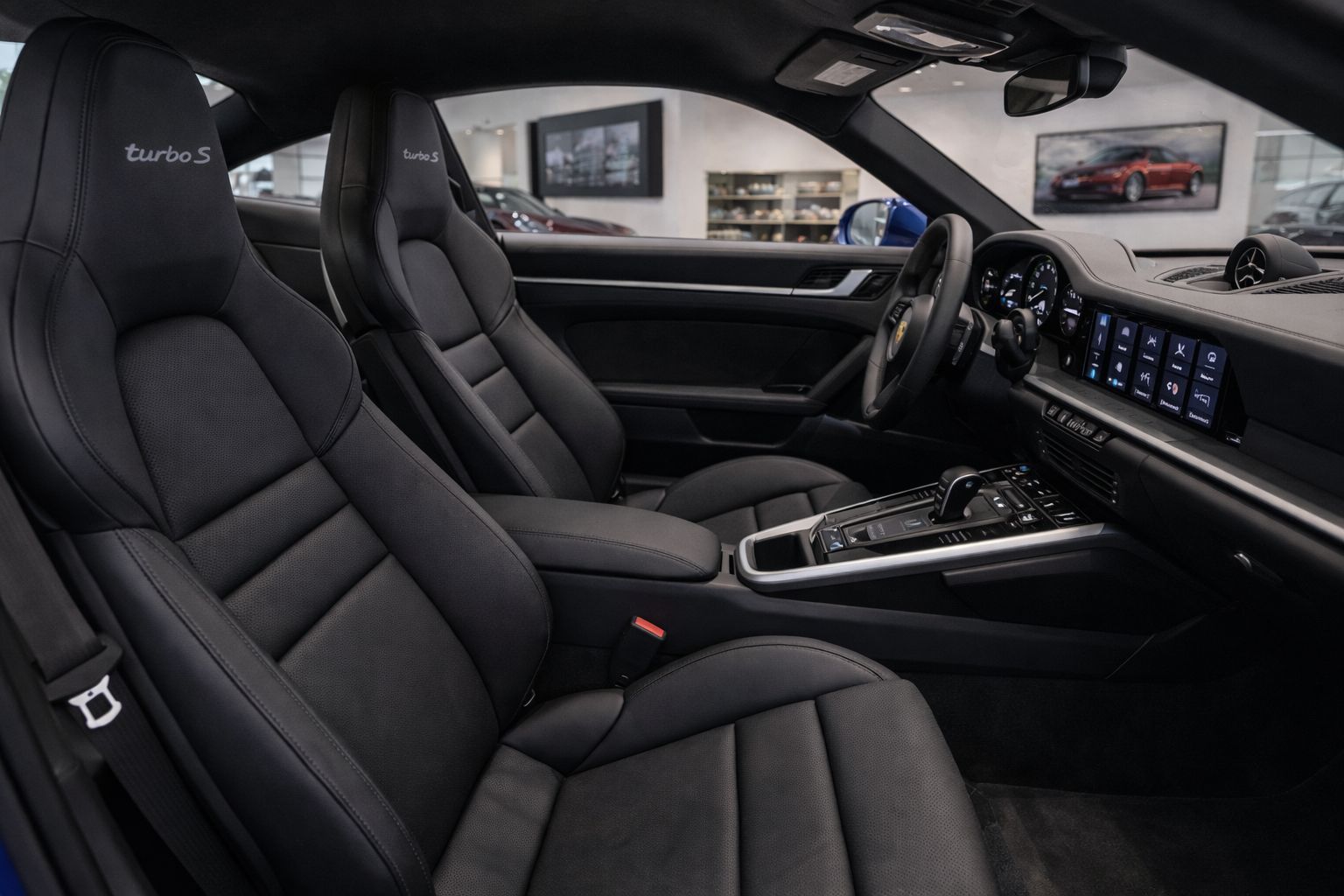 Interior passenger-side view showing seats and dashboard