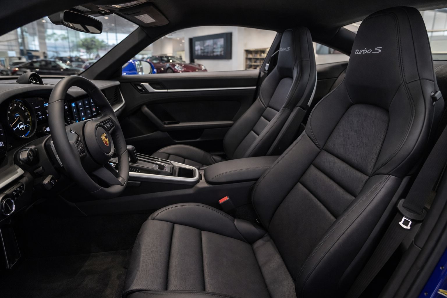 Front cabin view showing screens and center console