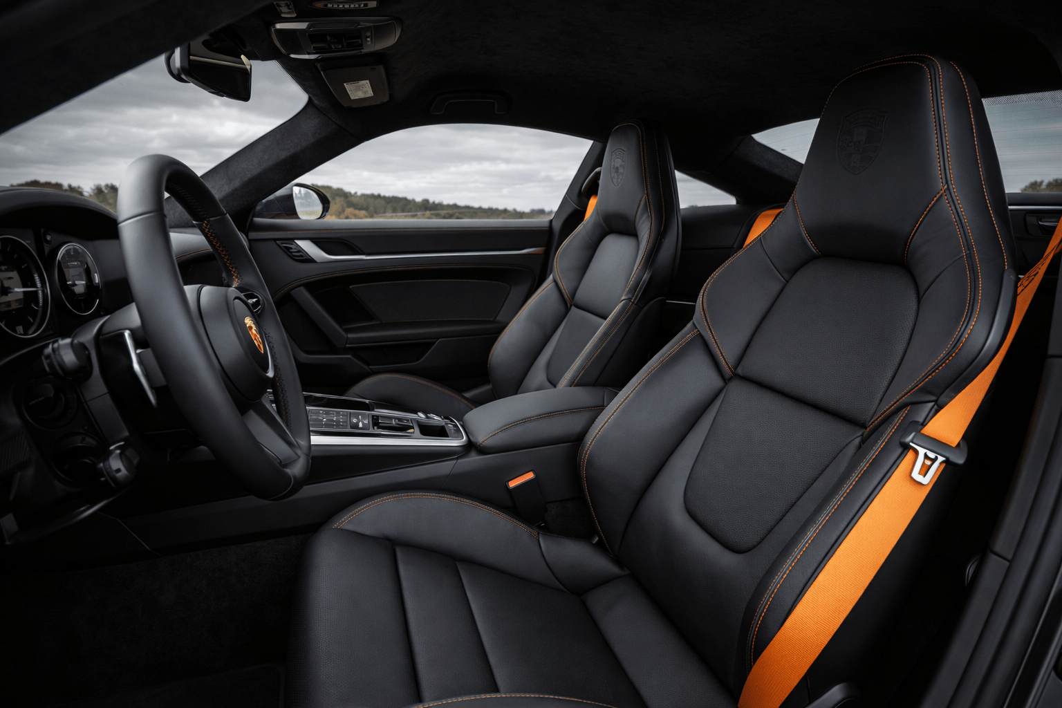 bespoke Porsche interior design Europe orange belts interior accent zones