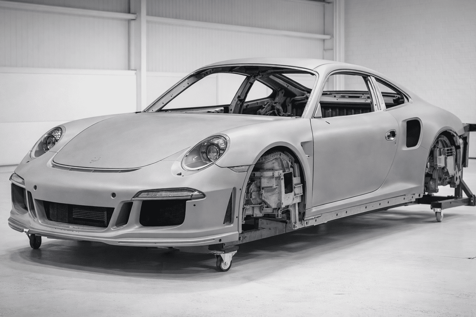 Porsche 991.2 Turbo S in primer during body refinement