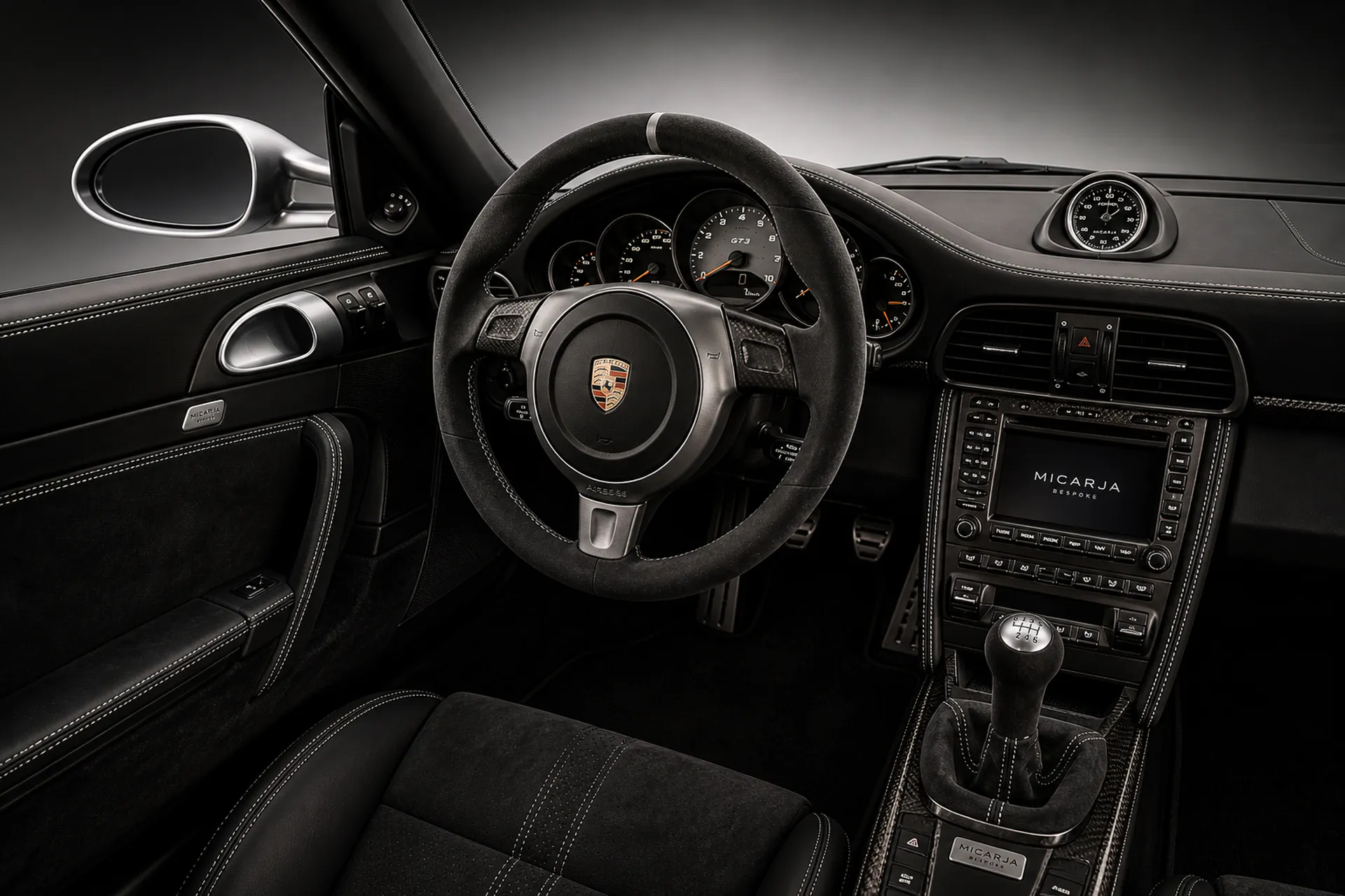 Bespoke Porsche steering wheel and driver control detail